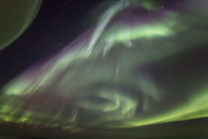 Northern lights above the central Arctic Ocean. This image was taken during an expedition of the German research icebreaker