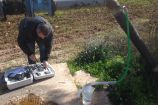 Dr. Hamdan collecting groundwater samples from domestic water wells