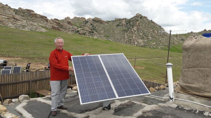 Prof Enebish Namjil, project partner in the BMBF-funded PV-2-Heat project, setting up a new PV system. Prof Enebish Namjil, project partner in the BMBF-funded PV-2-Heat project, setting up a new PV system.